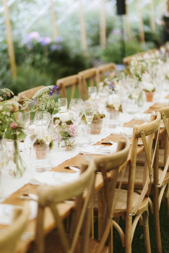 Cross back chairs and rustic trestle tables wedding breakfast